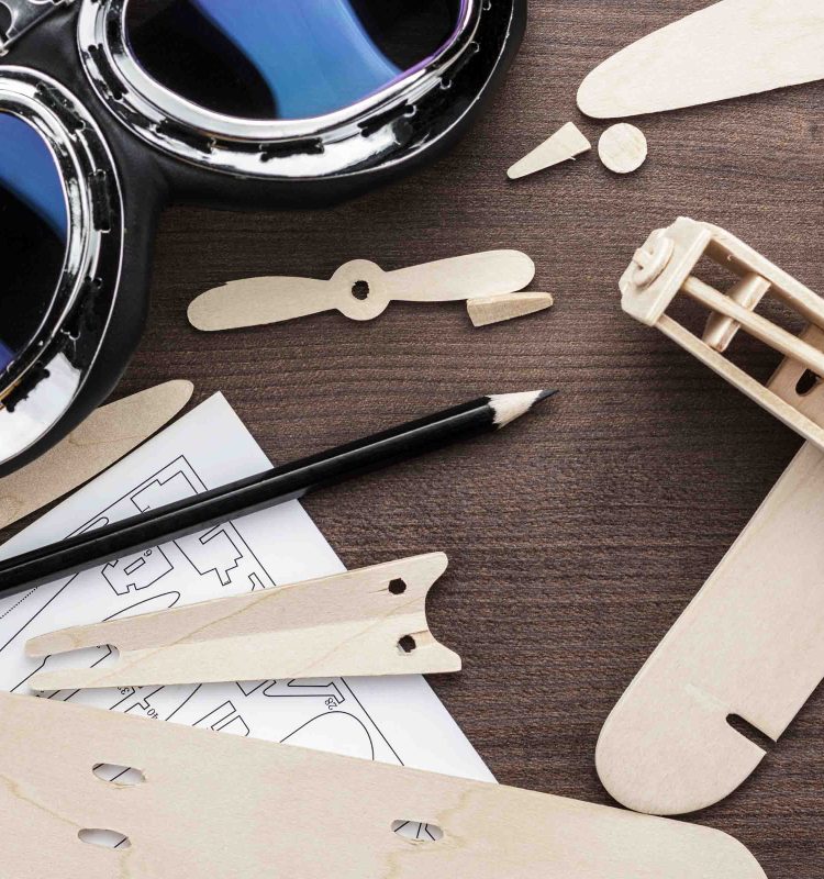 handmade airplane on the brown wooden table